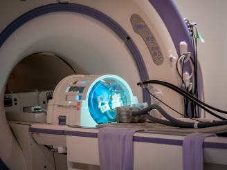 Robot prototype operating within a standard head coil in magnetic resonance imaging environment